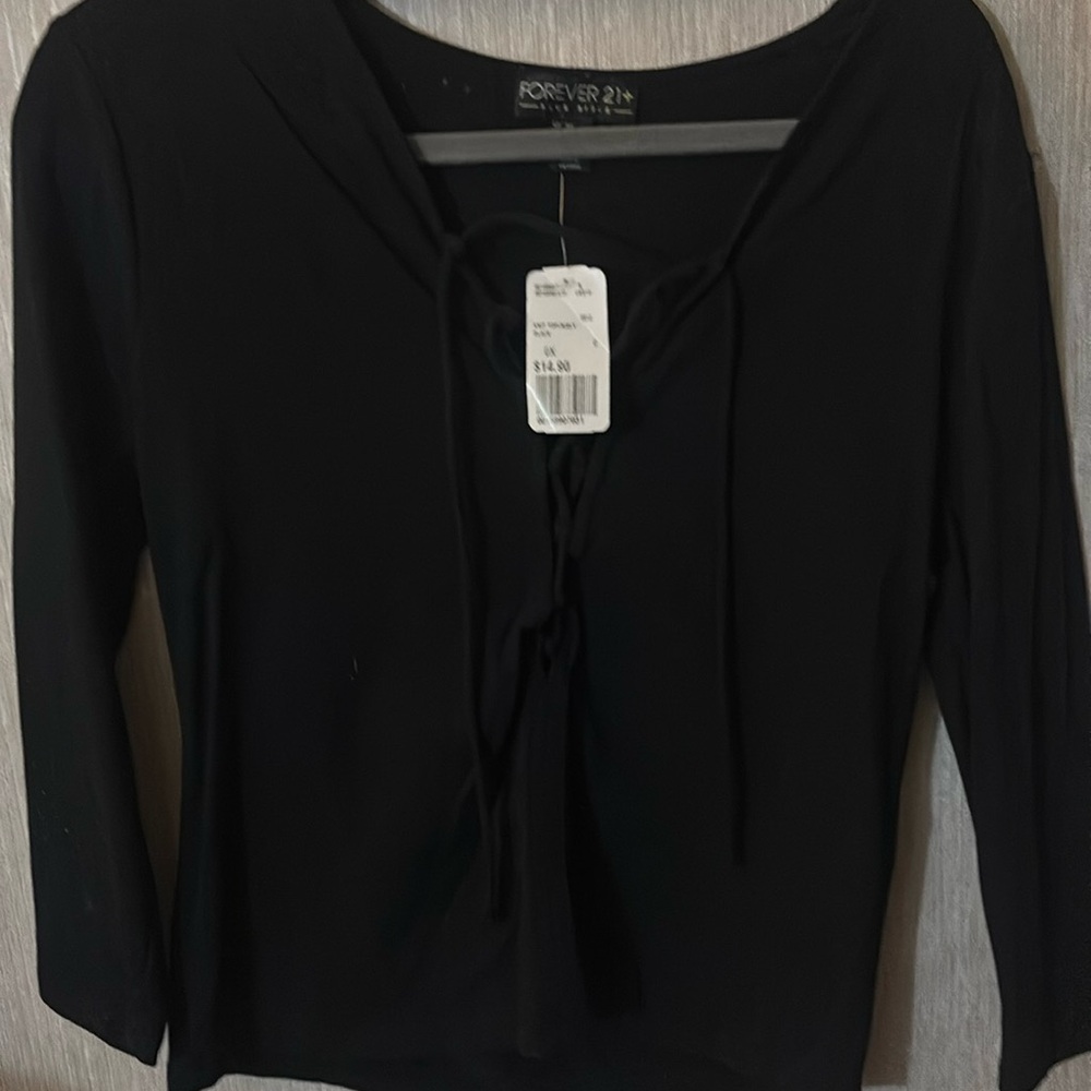 Forever 21 crossover tie up black shirt
Never worn